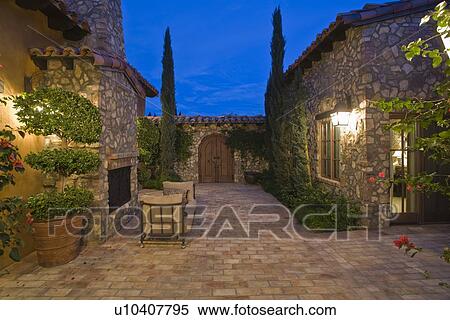 Paved courtyard exterior of Palm Springs home View Large Photo Image Stock Photography - Paved courtyard exterior of Palm Springs home. Fotosearch