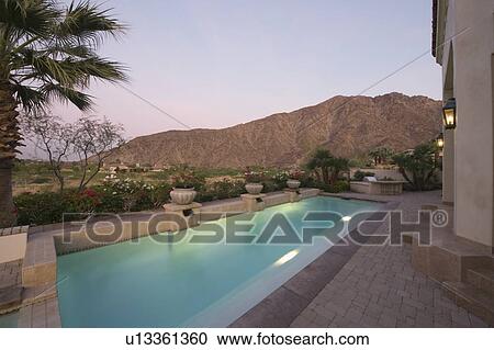 Paved poolside area of Palm Springs home View Large Photo Image Stock Image - Paved poolside area of Palm Springs home. Fotosearch