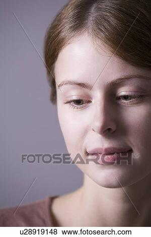 Pensive young woman close-up View Large Photo Image Stock Photo - Pensive young woman close-up . Fotosearch