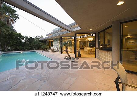 Stock Photo - Poolside area of palm Springs home. Fotosearch