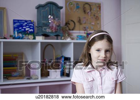 Portrait of girl standing in bedroom View Large Photo Image Stock Photo - Portrait of girl standing in bedroom. Fotosearch