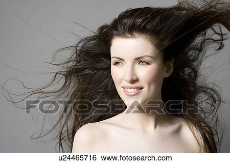Portrait of woman with wavy brown hair View Large Photo Image Stock Photograph - Portrait of woman with wavy brown hair. Fotosearch