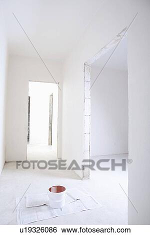 Pot of paint in hallway of new apartment View Large Photo Image Stock Photograph - Pot of paint in hallway of new apartment. Fotosearch