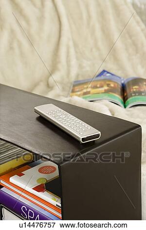 Remote control on shelf View Large Photo Image Stock Photo - Remote control on shelf. Fotosearch