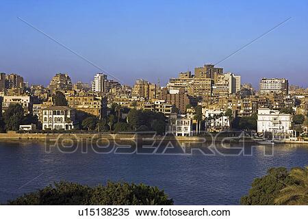 Stock Photography - River Nile and colonial mansions in foreground Gezira island Cairo. Egypt. Fotosearch