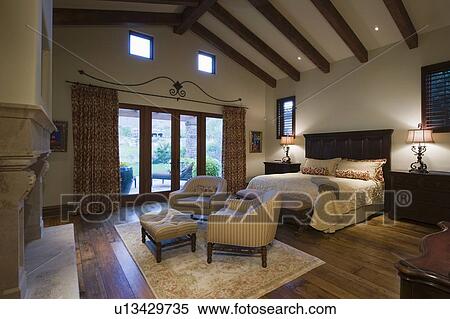 Seating area in beamed Palm Springs bedroom View Large Photo Image Stock Photography - Seating area in beamed Palm Springs bedroom. Fotosearch