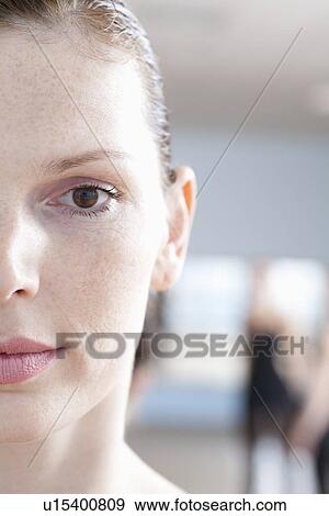 Stock Photo - Serious expression on young woman's face. Fotosearch