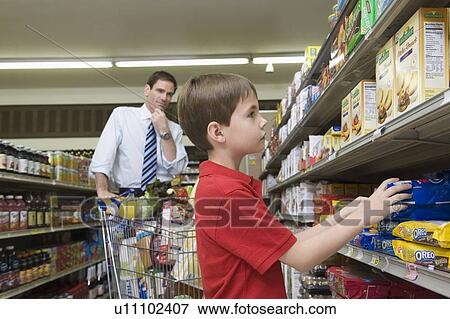 Single father shopping with son View Large Photo Image Stock Photo - Single father shopping with son. Fotosearch