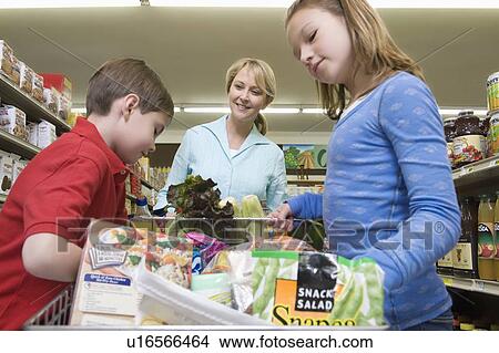 Single mother shopping with son and daughter View Large Photo Image Picture - Single mother shopping with son and daughter. Fotosearch