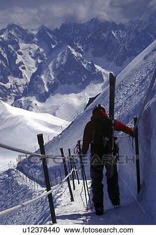 Skier on trail in winter French Alps. View Large Photo Image Stock Image - Skier on trail in winter French Alps.. Fotosearch
