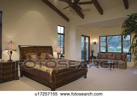 Stock Photography - Sleigh bed in Palm Springs home. Fotosearch