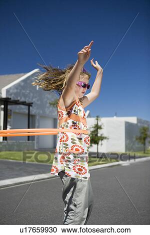 South Africa Cape Town girl playing with plastic hoop View Large Photo Image Stock Image - South Africa Cape Town girl playing with plastic hoop. Fotosearch