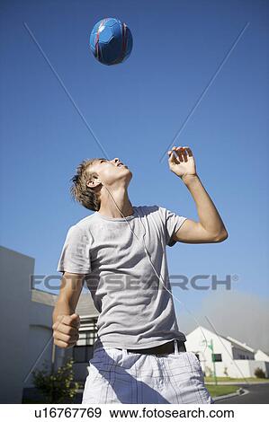 South Africa Cape Town teenage boy playing ball View Large Photo Image Stock Photo - South Africa Cape Town teenage boy playing ball. Fotosearch