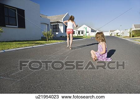 South Africa Cape Town two girls playing hopscotch on street View Large Photo Image Stock Image - South Africa Cape Town two girls playing hopscotch on street. Fotosearch