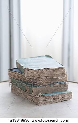 Stack of four old books View Large Photo Image Stock Photograph - Stack of four old books. Fotosearch