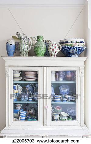 Storage cabinet with crockery View Large Photo Image Stock Image - Storage cabinet with crockery. Fotosearch