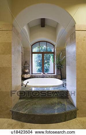 Picture - Sunken marble bath in Palm Springs home. Fotosearch