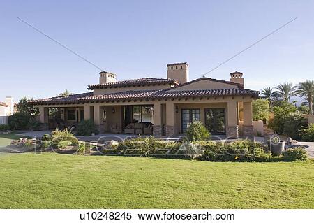 Sunlit garden exterior of Palm Springs home View Large Photo Image Stock Photography - Sunlit garden exterior of Palm Springs home. Fotosearch