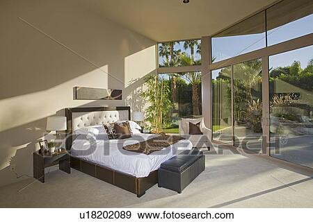 Stock Photo - Sunlit Palm Springs bedroom. Fotosearch