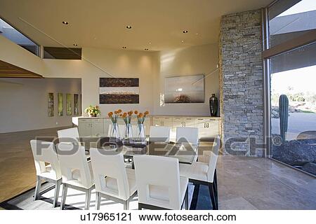 Stock Image - Sunlit Palm Springs dining room. Fotosearch