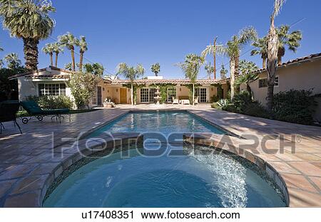 Swimming pool at back yard of luxurious residence View Large Photo Image Stock Image - Swimming pool at back yard of luxurious residence. Fotosearch