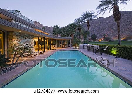 Stock Photo - Swimming pool exterior of Palm Springs home. Fotosearch