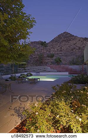 Stock Image - Swimming pool in backyard. Fotosearch