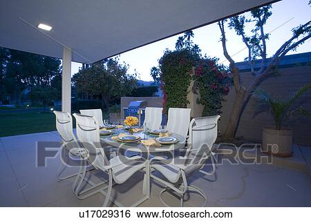 Table set for meal on patio View Large Photo Image Stock Photograph - Table set for meal on patio. Fotosearch