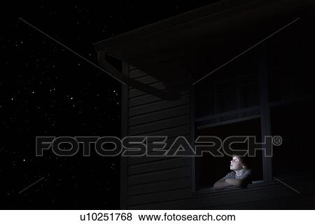 Teenage boy looks up at night sky View Large Photo Image Stock Photo - Teenage boy looks up at night sky. Fotosearch