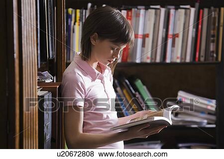 Teenage girl at library View Large Photo Image Stock Photo - Teenage girl at library. Fotosearch