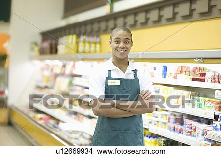 Teenage supermarket employee View Large Photo Image Picture - Teenage supermarket employee. Fotosearch