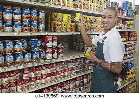 Teenage supermarket employee View Large Photo Image Stock Photo - Teenage supermarket employee. Fotosearch