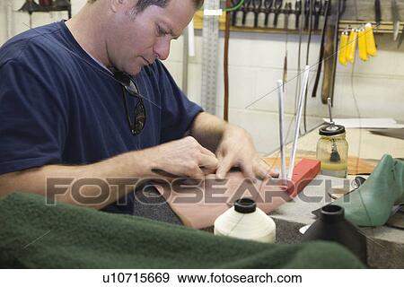 Stock Photo - Traditional shoemaker workshop. Fotosearch