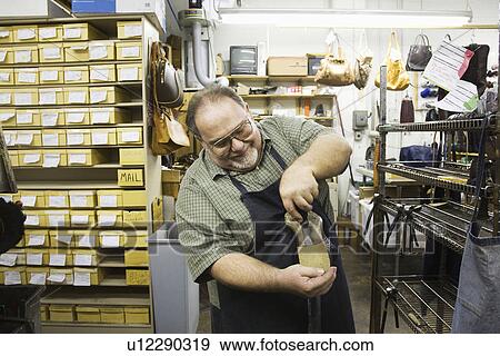 Stock Photo - Traditional shoemaker workshop. Fotosearch