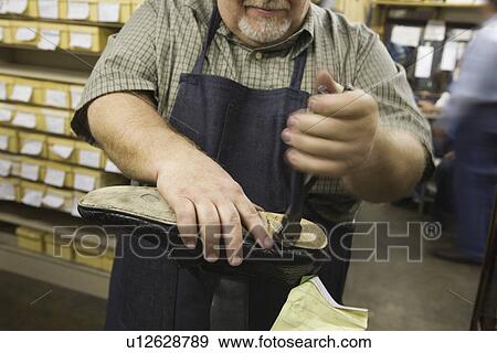 Traditional shoemaker workshop View Large Photo Image Stock Photo - Traditional shoemaker workshop. Fotosearch