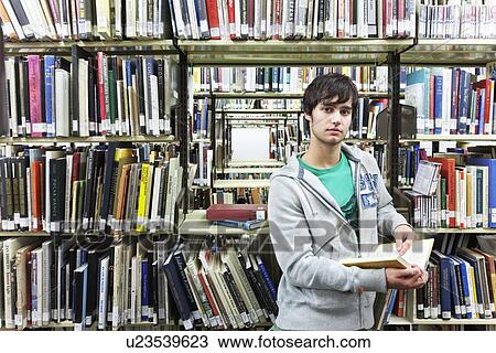 University student studying in library View Large Photo Image Stock Image - University student studying in library. Fotosearch