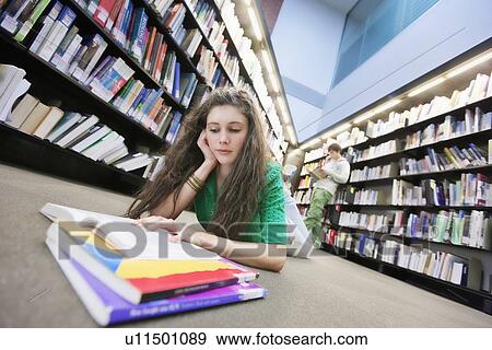 University student studying in library View Large Photo Image Stock Photo - University student studying in library. Fotosearch