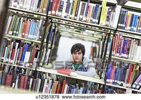 University student studying in library View Large Photo Image Stock Photo - University student studying in library. Fotosearch