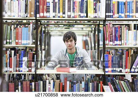 University student studying in library View Large Photo Image Stock Photo - University student studying in library. Fotosearch