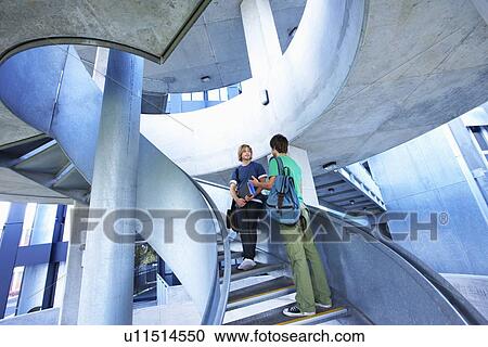 Stock Image - University students on staircase. Fotosearch