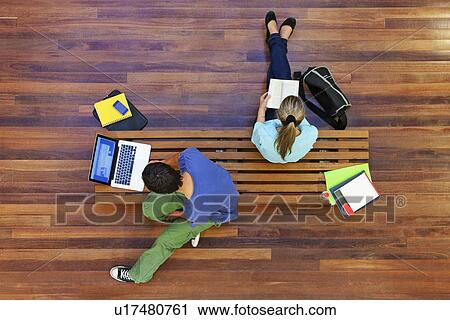 Stock Image - University students studying from above. Fotosearch