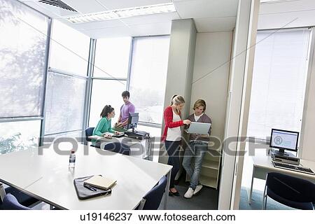 University students using computers View Large Photo Image Stock Photo - University students using computers. Fotosearch