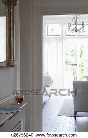 View through doorframe from hallway to living room View Large Photo Image Stock Image - View through doorframe from hallway to living room. Fotosearch