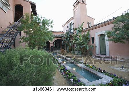 Water feature and metal steps of Palm Springs courtyard garden View Large Photo Image Stock Image - Water feature and metal steps of Palm Springs courtyard garden. Fotosearch