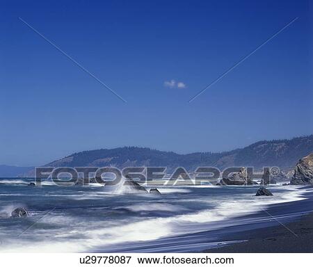 Waves crash against the rocks in Mendocino County California View Large Photo Image Stock Photo - Waves crash against the rocks in Mendocino County California. Fotosearch