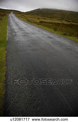 Wet road in Yorkshire Dales Yorkshire England View Large Photo Image Stock Photo - Wet road in Yorkshire Dales Yorkshire England. Fotosearch