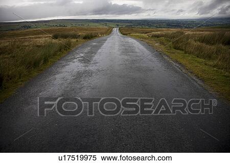 Stock Photography - Wet road in Yorkshire Dales Yorkshire England. Fotosearch