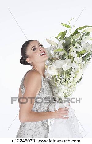 Woman accepts a bouquet of white flowers View Large Photo Image Stock Image - Woman accepts a bouquet of white flowers. Fotosearch