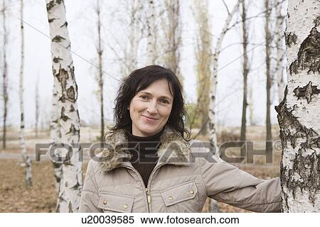 Woman in forest portrait View Large Photo Image Stock Photography - Woman in forest portrait. Fotosearch