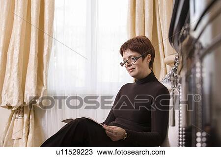 Woman reading View Large Photo Image Stock Image - Woman reading. Fotosearch